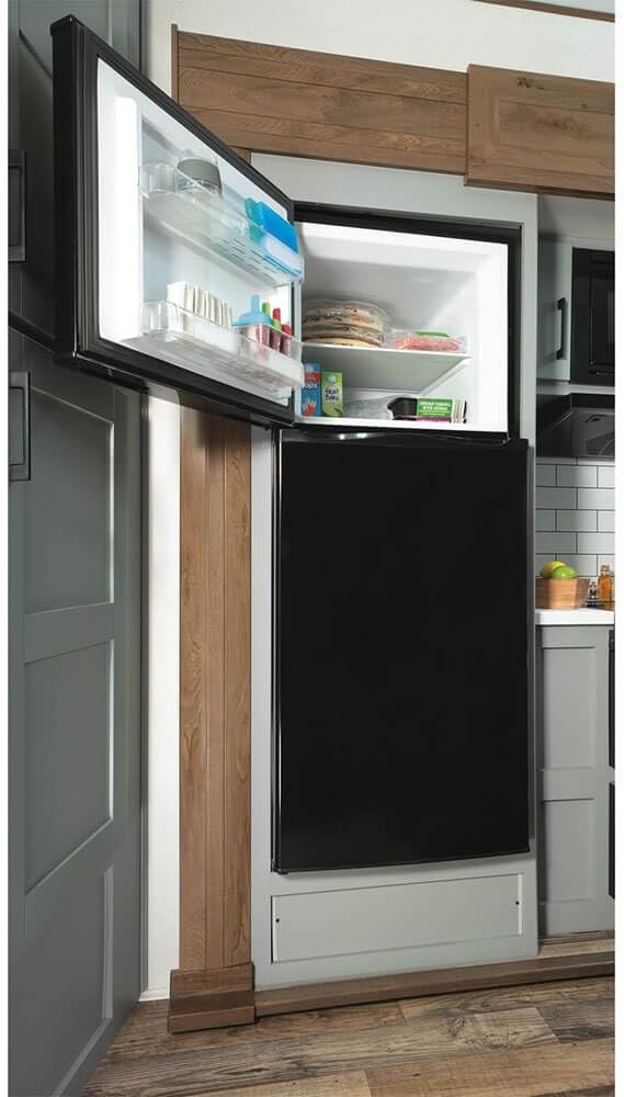 GE GPV10FGNBB 24' Top Freezer Refrigerator with 9.93 cu. ft. Capacity 12V DC Power Only LED Lighting and Adjustable Spillproof Glass Shelves in Black